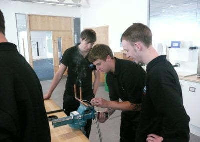 Apprentices go hands-on in a pipe systems workshop at Geberit UK in Warwick